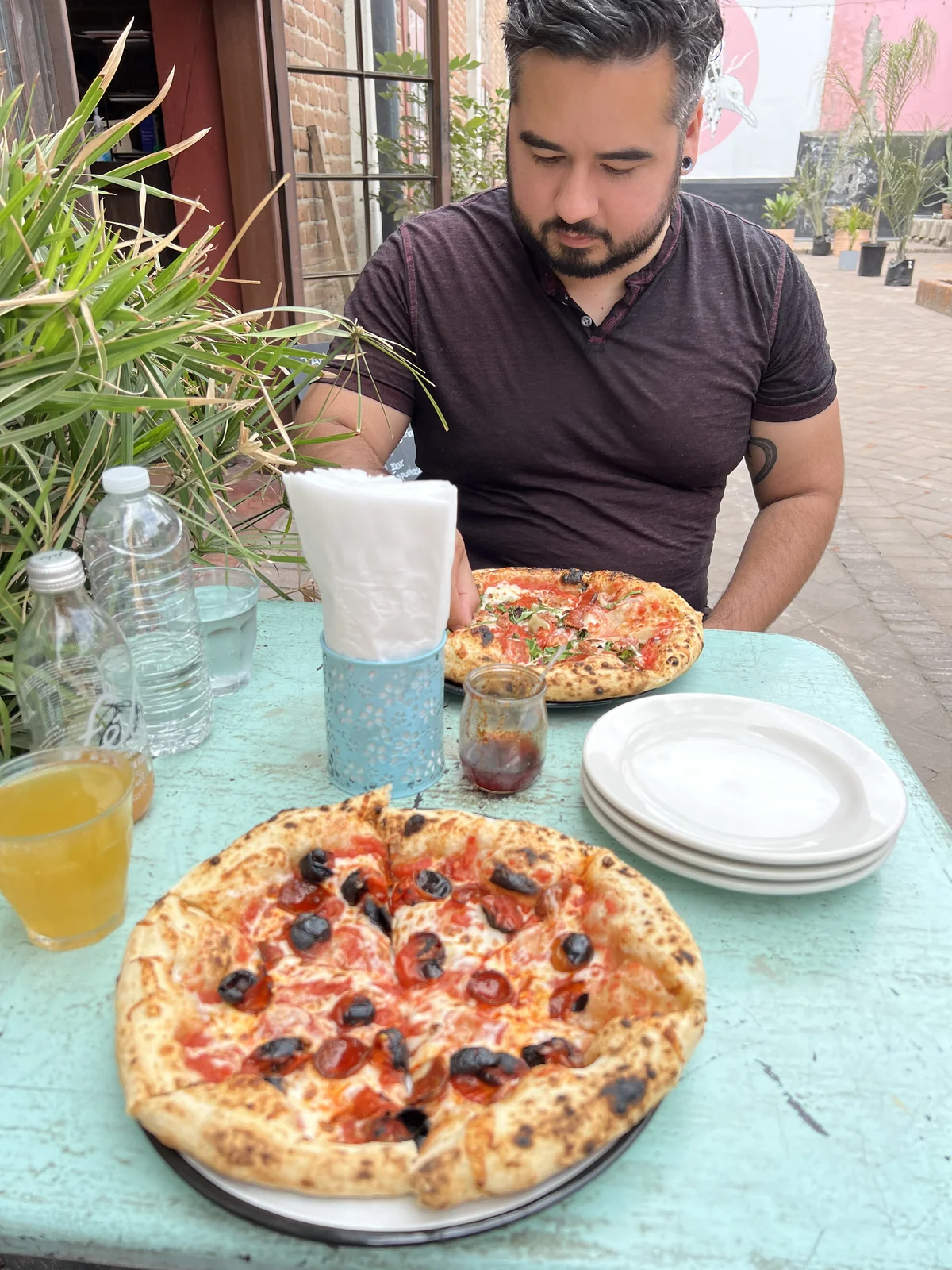 Michael and Bryan over pizza in Ensenada