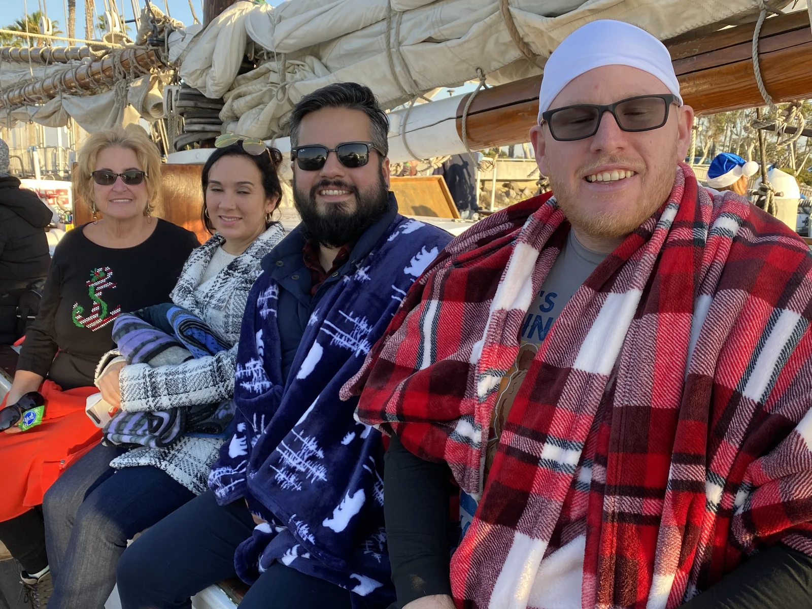 Michael, Bryan, Linda, and Linda's mom on a boat
