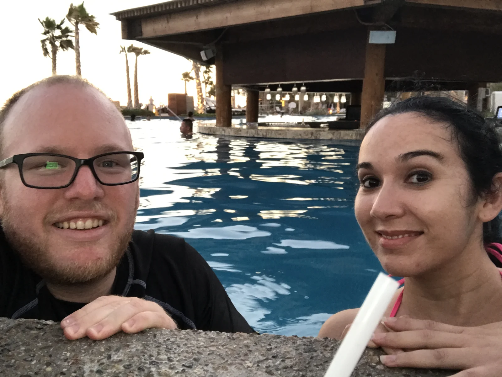Michael and Linda relaxing at a pool resort