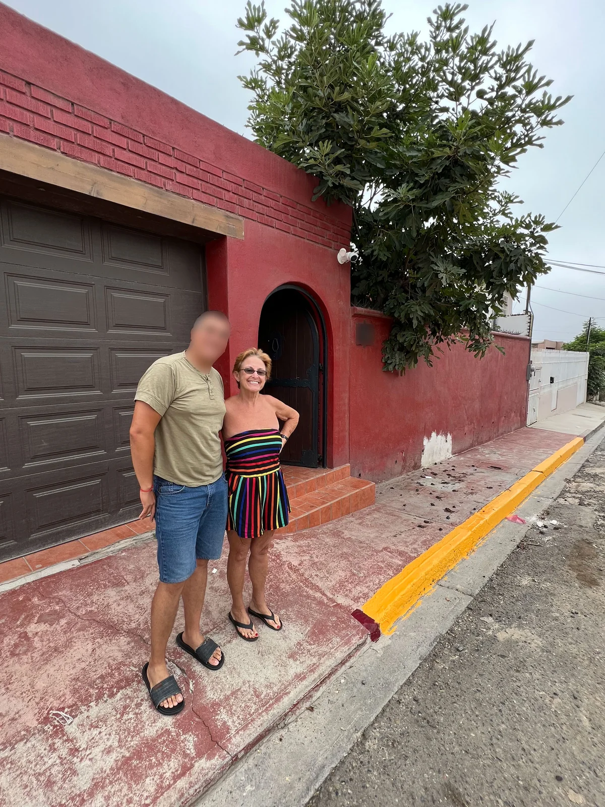 Michael's then-husband and his mom in front of the Ensenada house — she came to see the life and found it was real